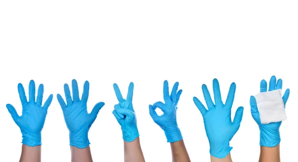 戴着蓝色乳胶手套的医生的手 — 图库照片