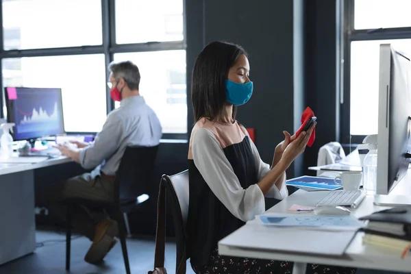 Asian Woman Wearing Face Mask Cleaning Her Smartphone While Sitting — Stock Photo, Image