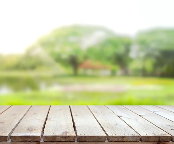 Mesa superior y desenfoque naturaleza el fondo — Foto de Stock