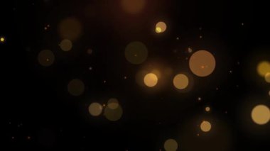 Soyut Altın Bulanık Bokeh arkaplanı ve koyu arkaplanda ışık parçacıkları. Odaklanmamış fotoğraf efekti. Yavaş çekim canlandırması