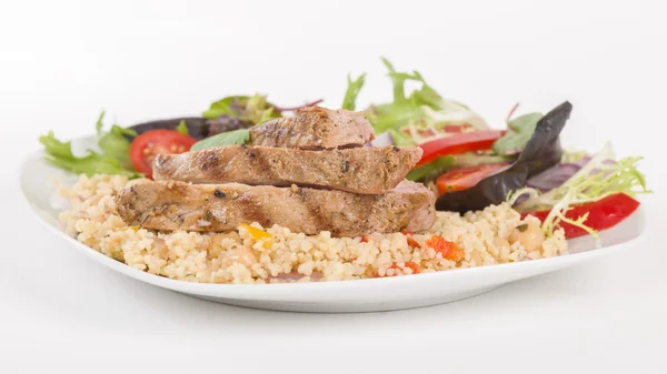 Gegrilltes Schweinefleisch und Couscous — Stockfoto