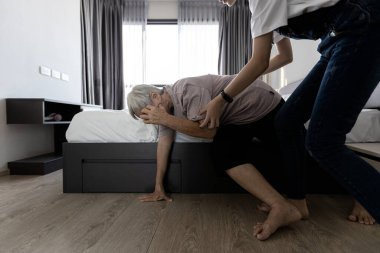 Asian old elderly with vertigo,trying to stand up after dizziness,loss of balance or staggered,symptoms of faint,dizzy,teen girl taking care of helping grandmother,support her senior woman in bedroom clipart