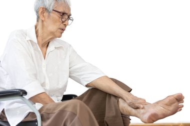 Asian senior woman massaging ankle and feet,old elderly had beriberi,cramp,numbness in her feet,sore toe joints,peripheral neuropathy disease,pain and swelling in the ankle bone,leg muscle weakness clipart