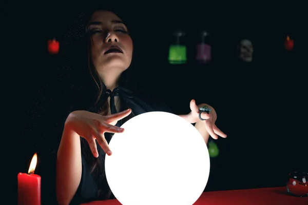 Fortune teller forecast future event or destiny by using crystal ball.