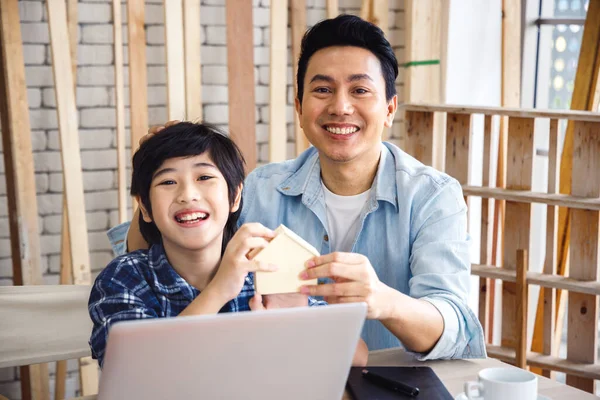 Happy Asian Father Son Holding Tiny Wooden House Model Using — Stock Photo, Image