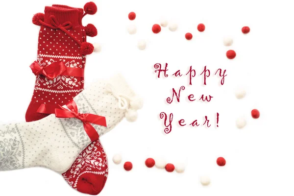 Wol kerst sokken, rood en wit, op wit Rechtenvrije Stockfoto's
