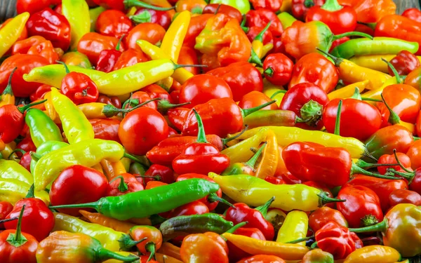 Assorted fresh and fiery hot chili peppers