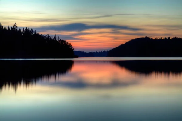 A sunset over a lake in sweden — Stock Photo, Image