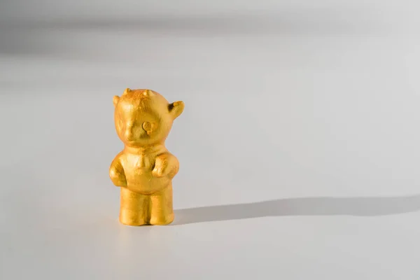 Golden bull ox on white background with sunlight shadows. Chinese New Year Lunar 2021 — Stock Photo, Image