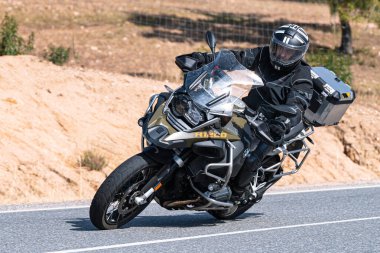 motorbike driving on the road, captured on October 18, 2020 in the town of Cebreros, Avila, Spai
