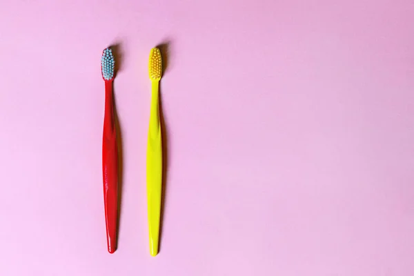 Top View Two Colored Tooth Brushes Red Yellow Laying Lilac — Stock Photo, Image