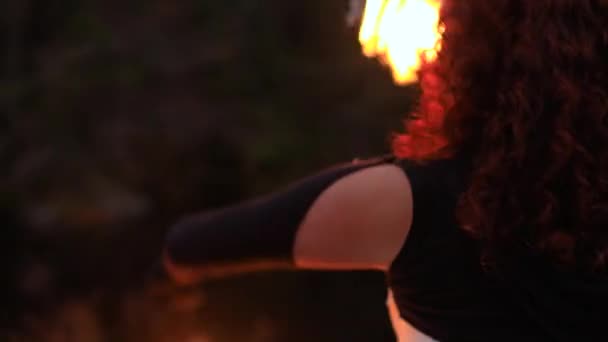 Woman spinning fire stick in circus — Stock Video