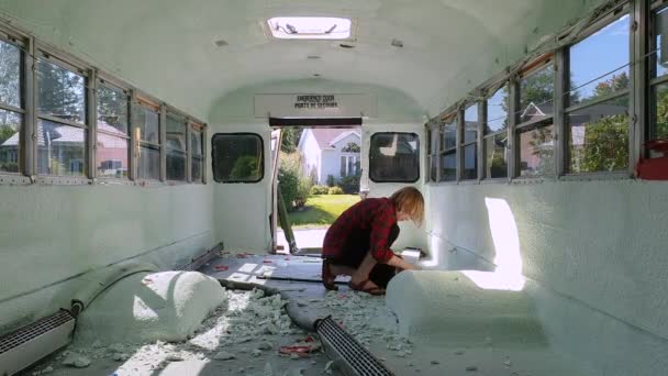 Insulation process of a school bus — Stock Video