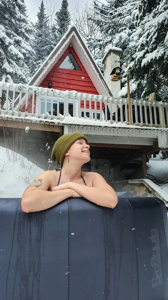 Relaxing in a hot tub under the snow