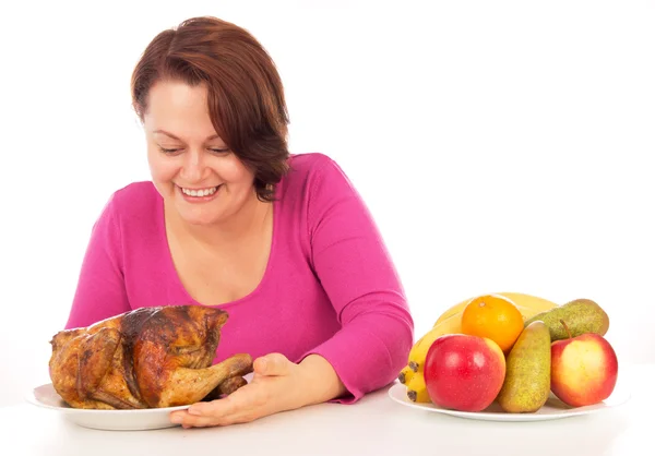 Full woman chooses what to eat — Stock Photo, Image