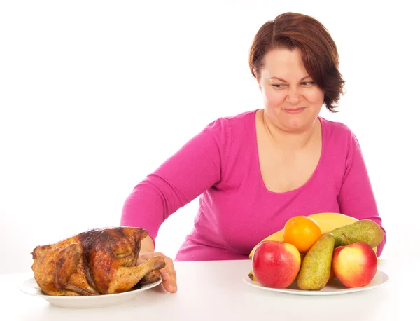 Mulher cheia não quer comer frango — Fotografia de Stock