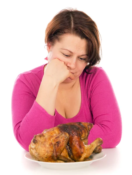 Volle Frau auf Diät, möchte Hühnchen essen — Stockfoto
