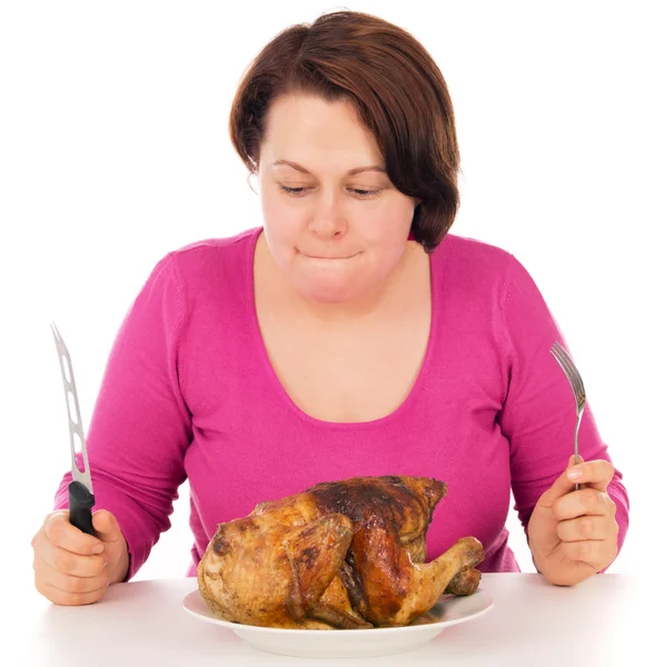 La mujer completa a la ración comienza a comer el pollo — Foto de Stock