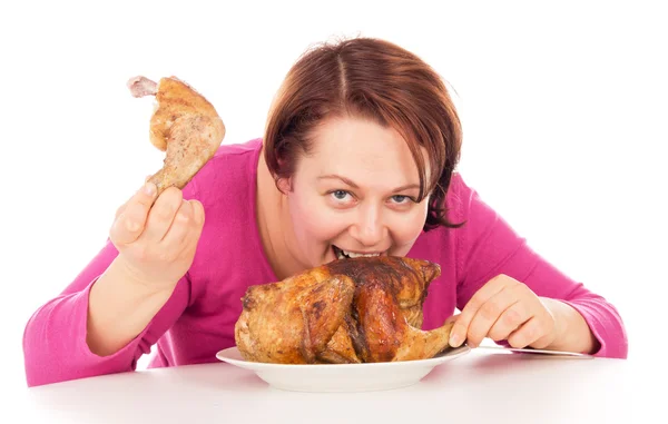 Kobieta pełna łapczywie absorbujących kawałek kurczaka — Zdjęcie stockowe