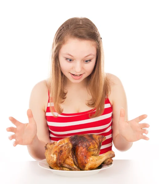 Beautiful girl happily looking at the chicken — Stock Photo, Image