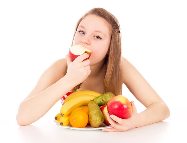 Menina bonita comer frutas — Fotografia de Stock