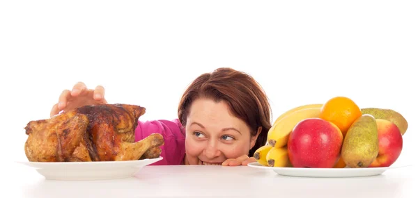 Full woman wants to steal the chicken — Stock Photo, Image