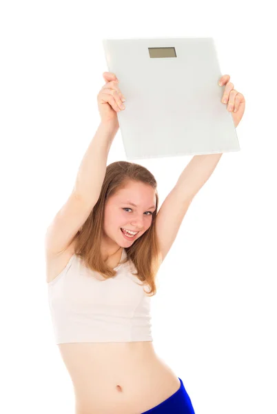 Girl holds the scales in his hand, and rejoices its achievements — Stock Photo, Image