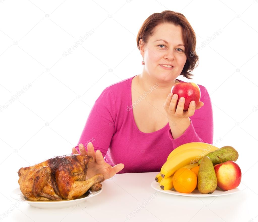 Full woman chooses what to eat