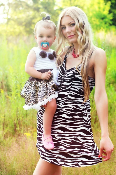 Beautiful mother holding a baby — Stock Photo, Image