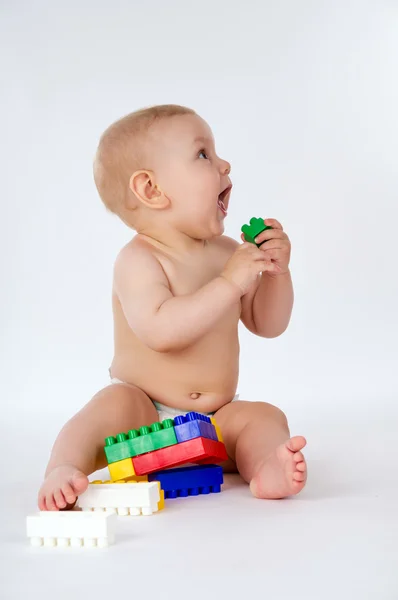 Little boy playing with toys Stock Image