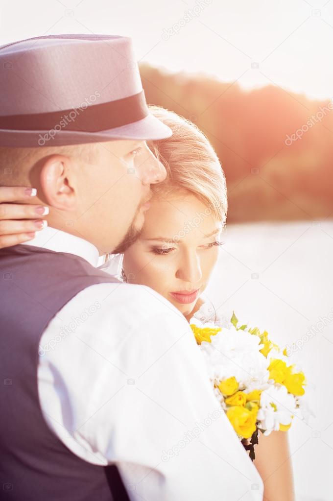 Wedding, the bride and groom at sunset