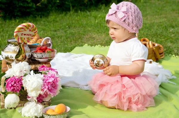 Beautiful little girl at picnic, outdoors — Stock Photo, Image