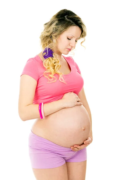 Grávida menina abraçando barriga — Fotografia de Stock