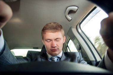 Driver fell asleep at the wheel of a car clipart
