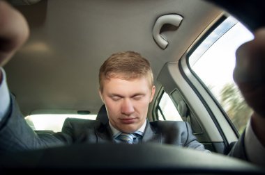Driver fell asleep at the wheel of a car while driving clipart