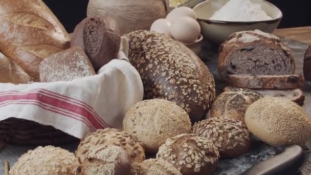 Different Types Fresh Baked Dutch Bread Wooden Table Camera Panning — Stock Video