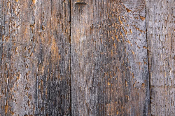 Hintergrund von braunen und grauen alten vertikalen Platten mit Kratzern — Stockfoto