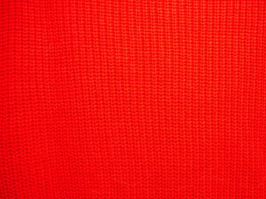 İplikten örülmüş yün kumaş dokusu, yakın plan. Arkaplan için resim, duvar kağıdı. Yün halı ya da kazak. Kırmızı doku. Modern tasarım.