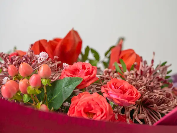 Fresh colorful variety flowers for sale at market. Flower arrangement of different colors. The photo is processed in vintage style.