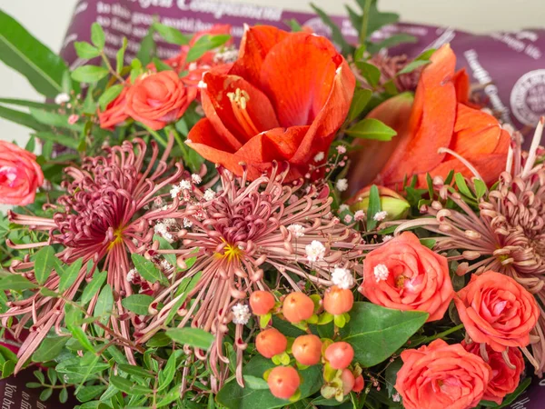 Fresh colorful variety flowers for sale at market. Flower arrangement of different colors. The photo is processed in vintage style.