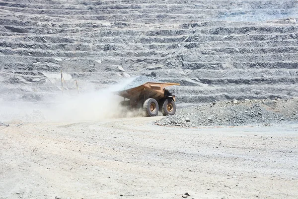 Dust raised by a dump truck at a copper mine