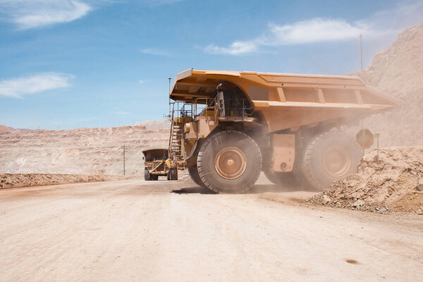 Big dump trucks at an open-pit copper mine in Peru.