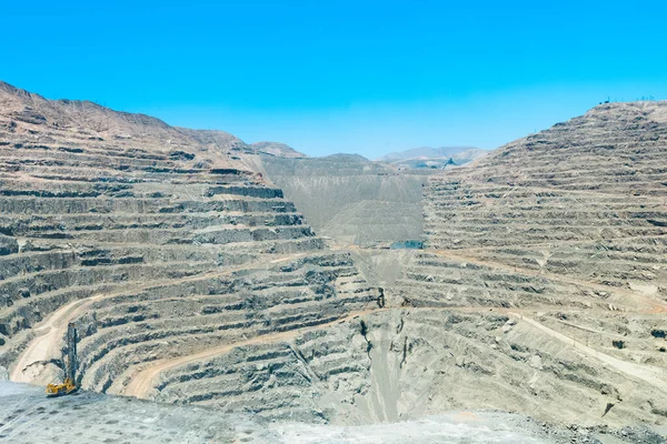 View from above of the pit of an open-pit copper mine in Chile