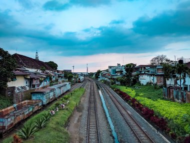 malang, indonesia -31 may, 2021: seen from above the train tracks and Kotabaru station in Malang city photographed in the afternoon