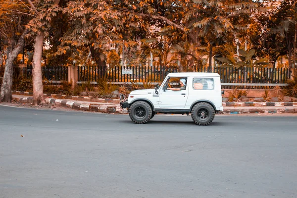 malang, Indonesia -19 july, 2021: Private car, turning after passing the intersection in front of rsi aisyiyah malang hospital in malang city