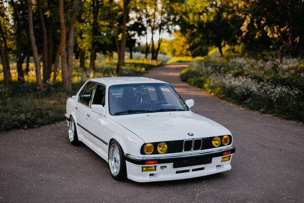 Берлин, Германия - 07 июля 2020 года: BMW M3 e30 outdors, BBS wheels, tunning M Tech, glossy and shiny old classic retro oldtimer. Авто-ностальгия.