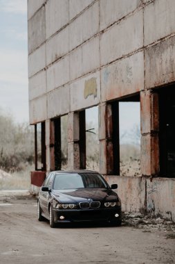 Rivne, Ukraine - September 26, 2019: BMW 5 series e39 at the old industrial building.