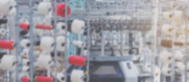 Tekstil endüstrisi metin için arkaplan afişini bulanıklaştırdı.