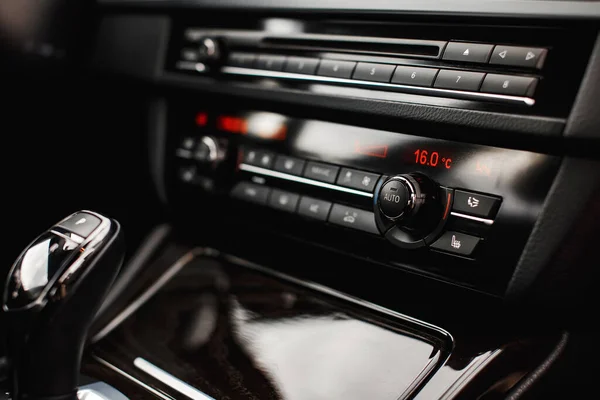 Air condition in auto. Climate control button. Car interior detail.