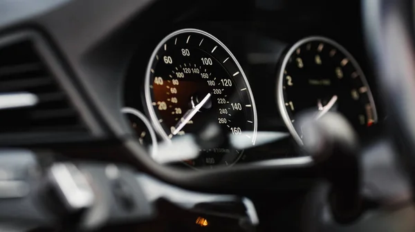 Car instrument panel. Dashboard closeup with speedometer and tachometer. Odometer, tachometer.